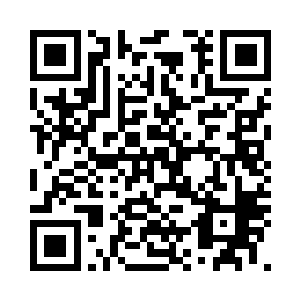 陆为民和吕腾站在丰州饭店大厅门口二维码生成