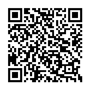 陈小练看见一个黑人士兵举起枪托朝着自己砸来二维码生成
