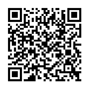 风难得的吹散了桑巴国首都内弥久不散的尘土味二维码生成